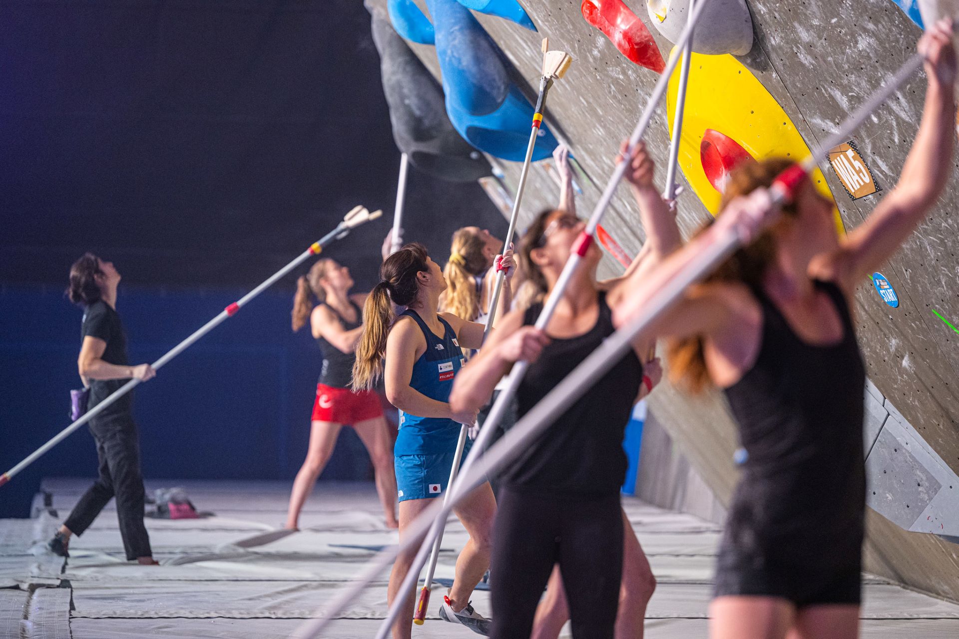 woman climbing a wall